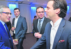 Right, former Vimy Conservative candidate Anthony Mavros greets Tony Clement during the meet-and-greet event held at The Palace last week.