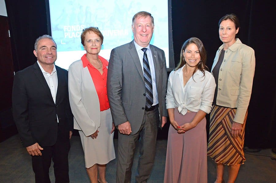 Mayor Marc Demers and four of five of the consultative committee for the Place-du-Souvenir Fund following the announcement at city hall.
