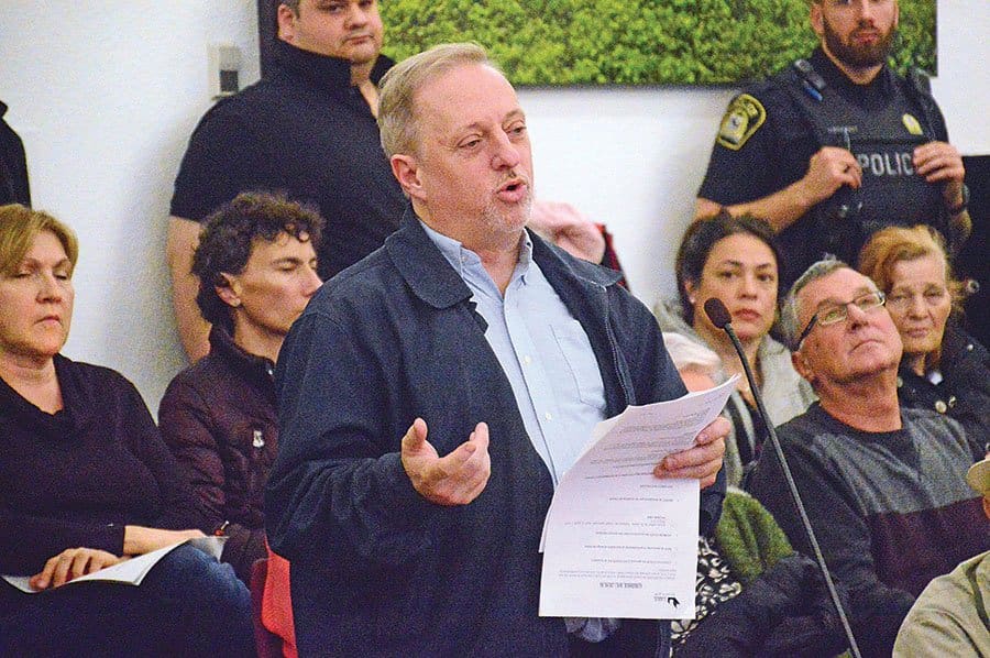 Unionized workers make noisy statement outside council meeting